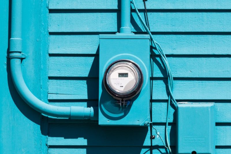 smart-grid-electric-meter-connection-on-blue-wall